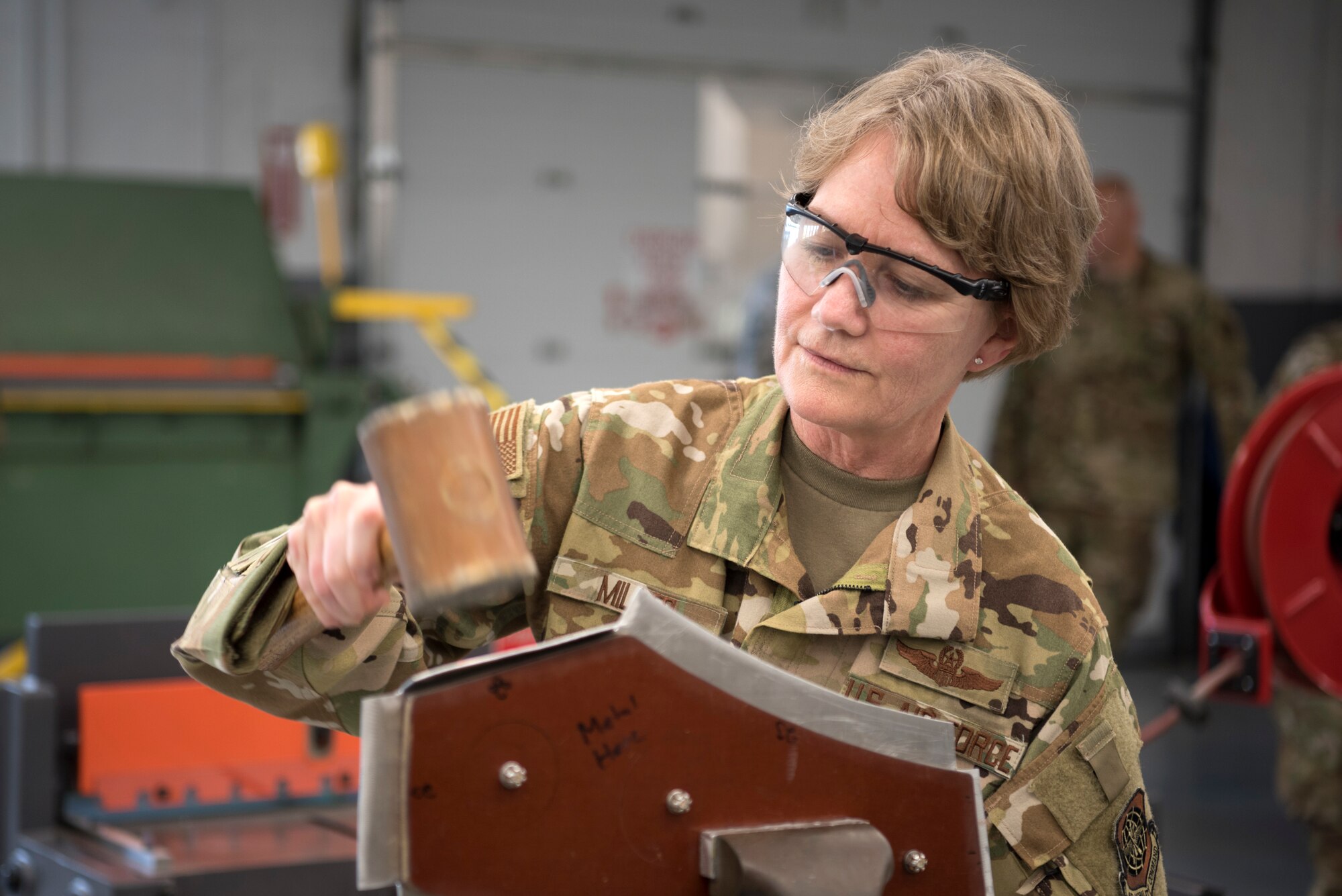 U.S. Air Force Gen. Maryanne Miller, Air Mobility Command commander, molds a piece of metal during a visit to the fabrication flight at MacDill Air Force Base, Fla., Feb. 13, 2020. Miller visited MacDill and toured various squadrons around the base Feb. 12-14, 2020.