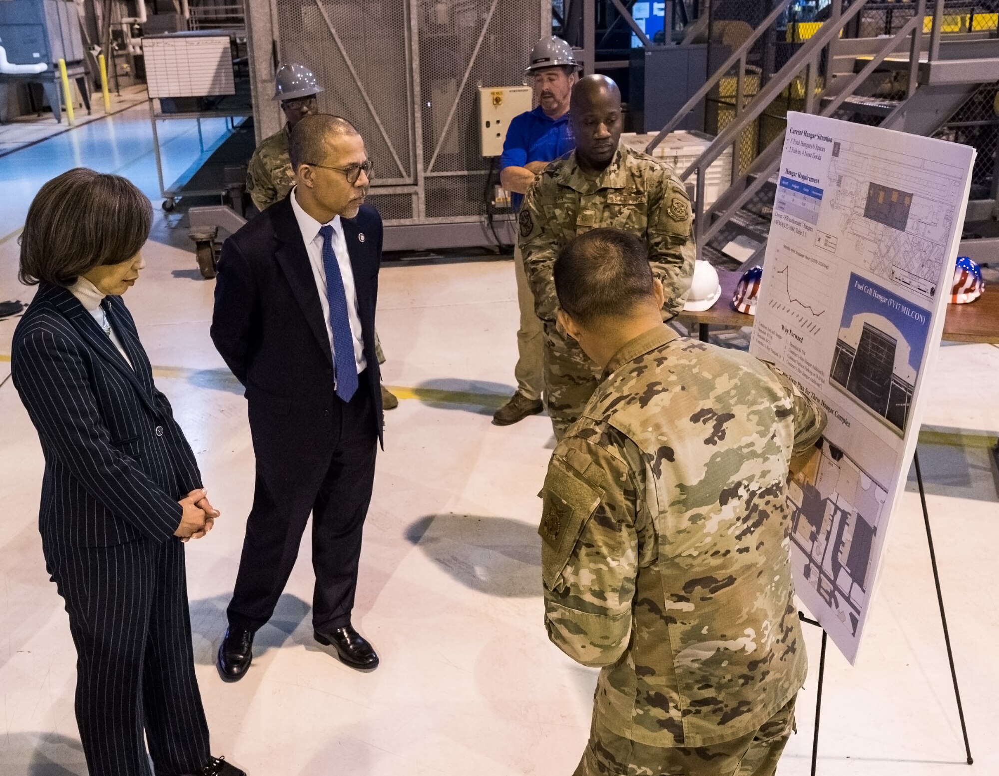 Lt. Col. Vhance Valencia, 436th Civil Engineer Squadron commander, points out current status and proposed hangar construction projects to Rep. Lisa Blunt Rochester, of Delaware, and Rep. Anthony Brown, of Maryland, Feb. 14, 2020, on Dover Air Force Base, Delaware. Valencia briefed the representatives on the long-term plan for a three hangar complex. (U.S. Air Force photo by Roland Balik)