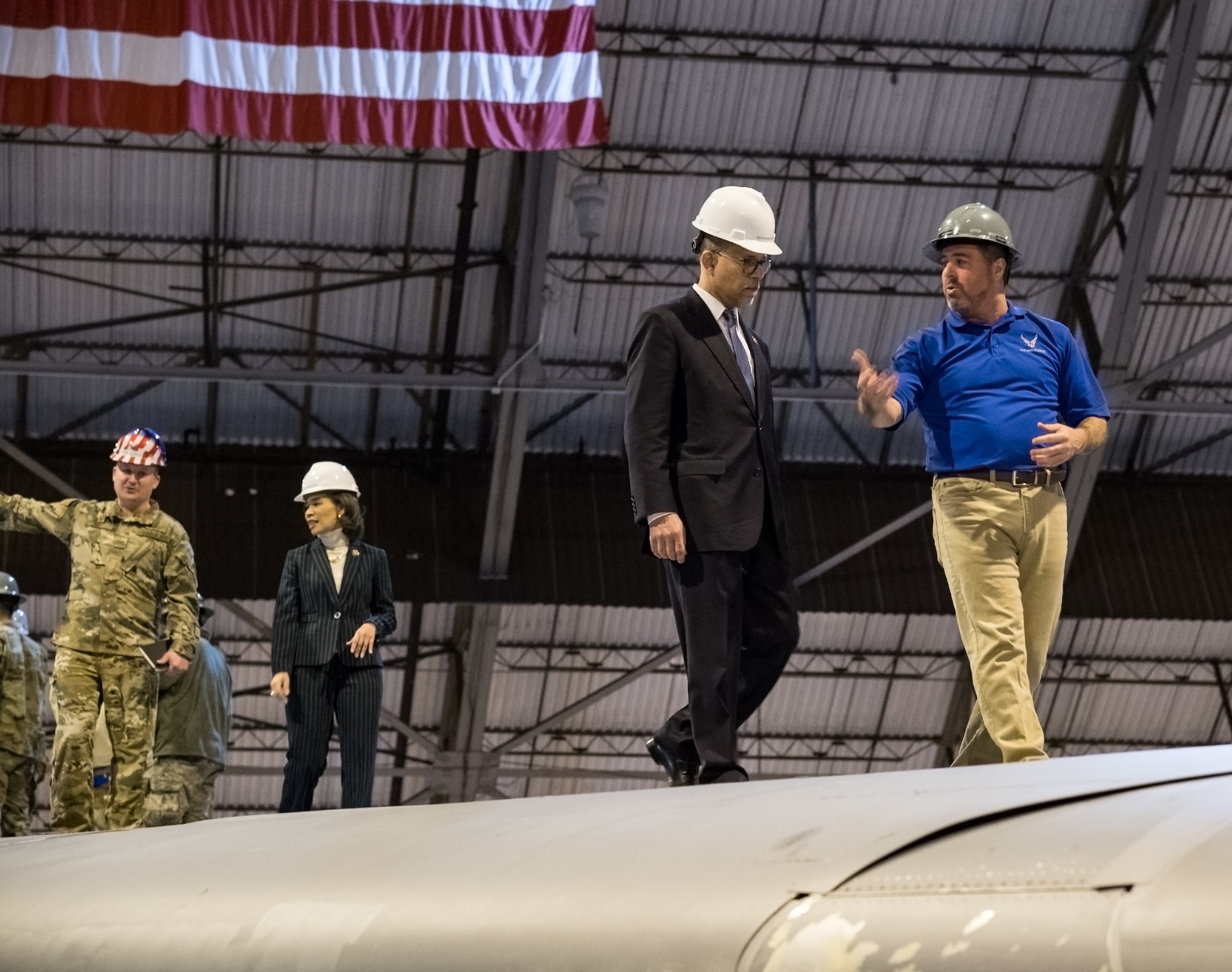 John Greim, 436th Maintenance Squadron Isochronal Inspection Dock controller, explains the C-5M isochronal inspection process to Rep. Anthony Brown, of Maryland, as they walk down the wing of a C-5M Super Galaxy Feb. 14, 2020, on Dover Air Force Base, Delaware. Walking behind Greim and Brown are Col. Matthew Jones, 436th Airlift Wing commander, and Rep. Lisa Blunt Rochester, of Delaware. (U.S. Air Force photo by Roland Balik)