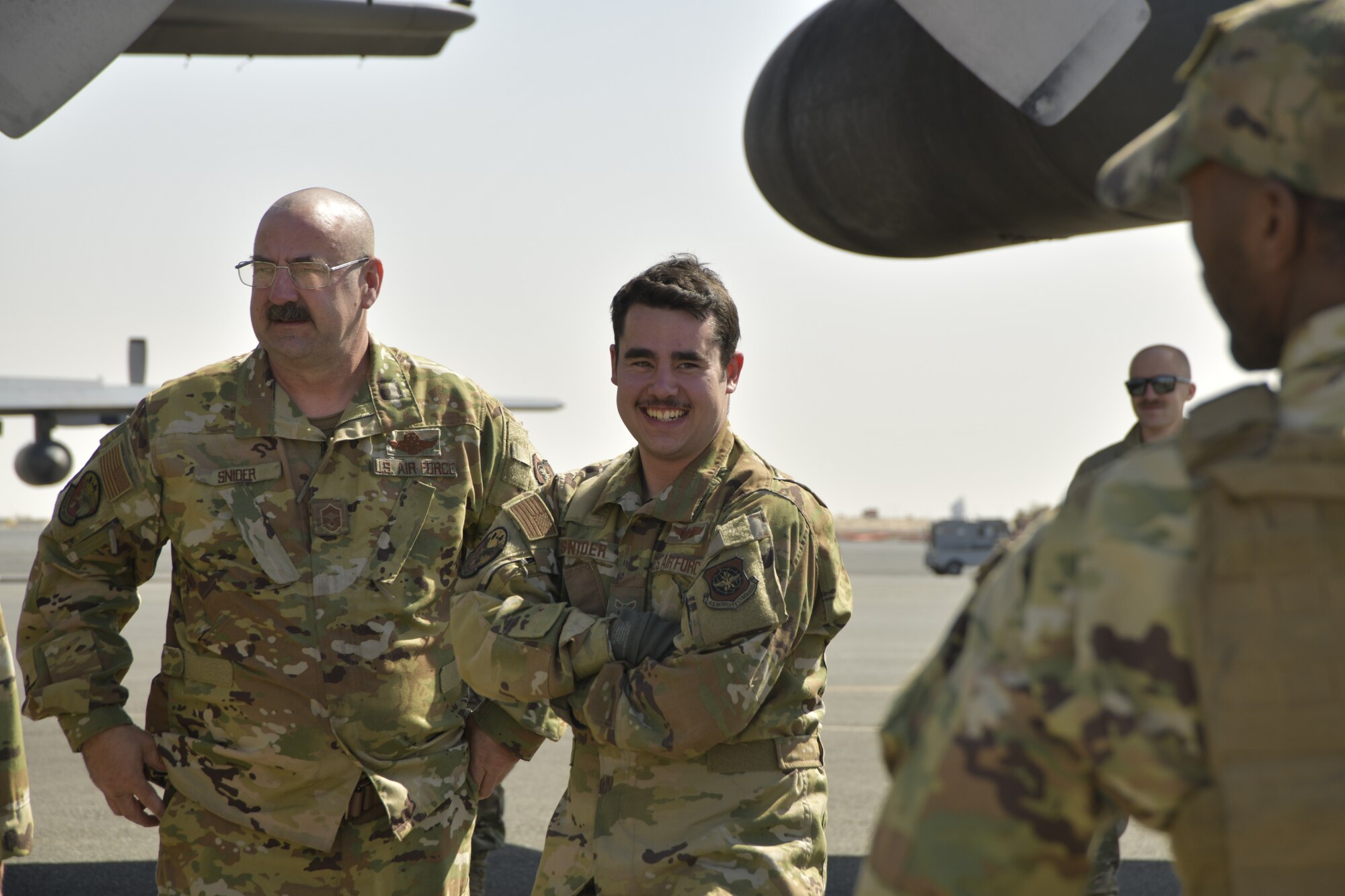 a picture of Airmen and Aircraft