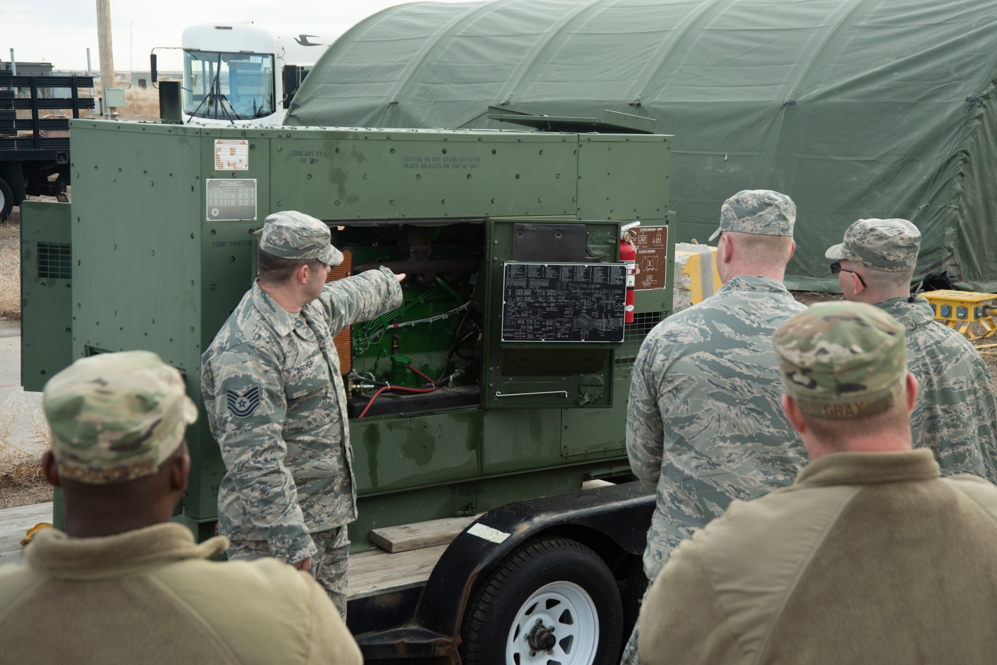 U.S. Air Force Tech. Sgt. Chris Archer, 366th Civil Engineering Squadron power production craftsman, teaches the trainees the components of a generator, Jan. 23, 2020, on Mountain Home Air Force Base, Idaho. The briefing prepares the trainees on what to do if the members of the power production crew are not available. (U.S. Air Force photo by Airman 1st Class Akeem K. Campbell)