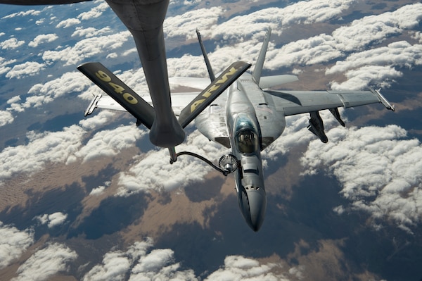 A U.S. Navy F/A-18 Super Hornet receives fuel from a KC-135 Stratotanker assigned to the 28th Expeditionary Air Refueling Squadron over Afghanistan, Jan. 14, 2020. The 28th EARS, deployed with U.S. Air Forces Central Command, is responsible for delivering fuel to U.S. and coalition forces, enabling a constant presence in the area of responsibility. (U.S. Air Force photo by Staff Sgt. Bethany E. La Ville)