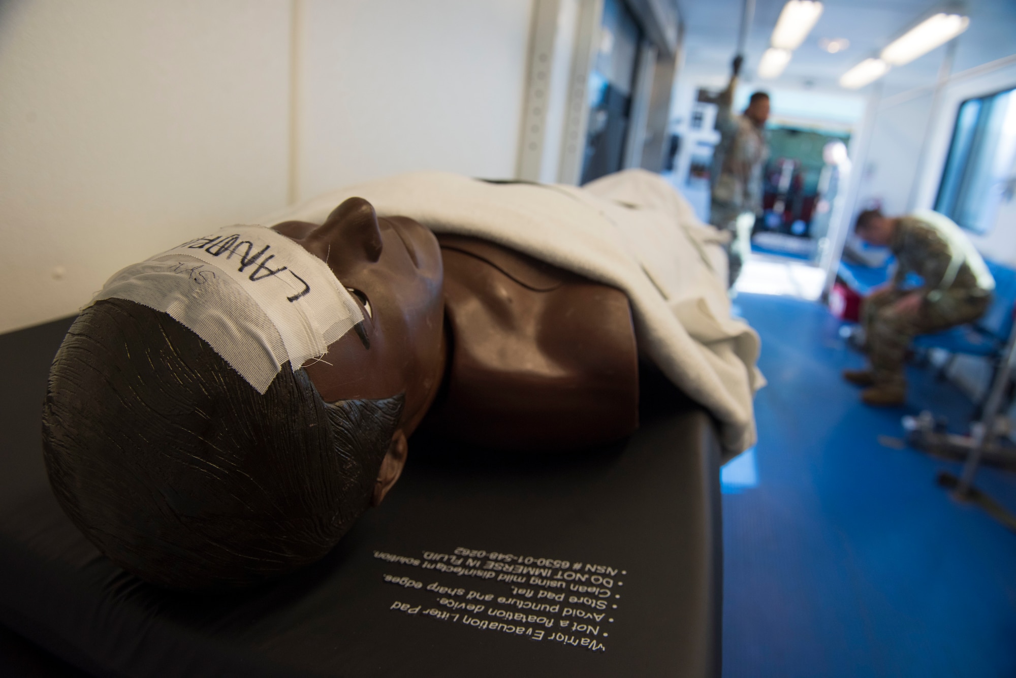 A training mannequin waits to be loaded on to a Fairchild Air Force Base KC-135 Stratotanker for an aeromedical evacuation training mission at Travis Air Force Base, California, Feb. 11, 2020. The Stratotanker is capable of transporting litter and ambulatory patients using patient support pallets during aeromedical evacuations. (U.S. Air Force photo by Senior Airman Lawrence Sena)