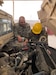 Sgt. 1st Class Joshua Watson, maintenance management noncommissioned officer in charge (NCOIC), Area Support Group – Qatar (ASG-QA), works with another ASG-QA Soldier to conduct a maintenance inspection at Camp As Sayliyah, Qatar, Feb. 18, 2020. (Courtesy photo)