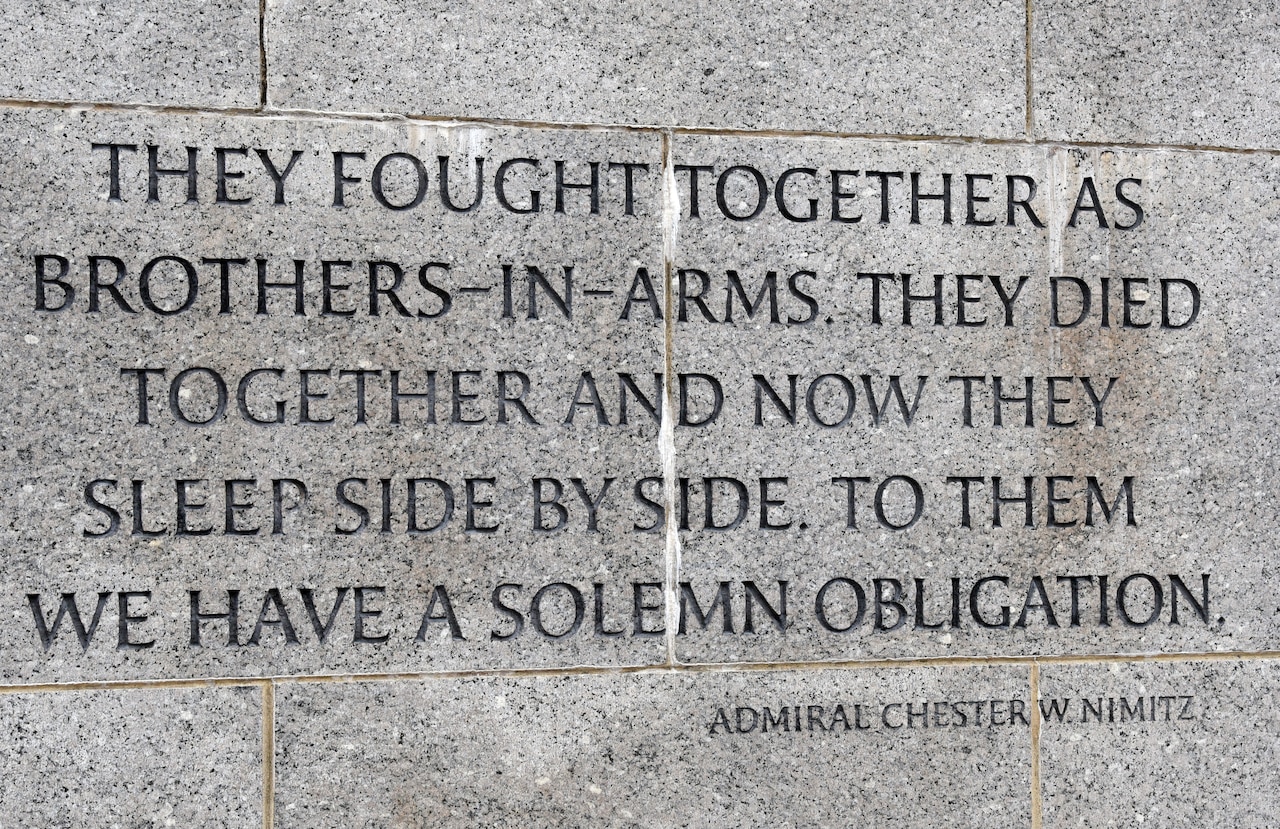 Inscription on stone wall of memorial.