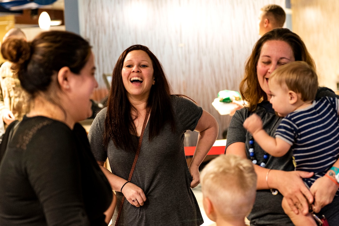 Photo of spouses sharing a laugh.