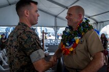 U.S. Marine Corps Sgt. Maj. Charles Well, sergeant major, Marine Corps Base Hawaii, shakes Lt. Col. William Smith's hand during Smith's retirement ceremony, Joint Base Pearl Harbor-Hickam, Feb. 14, 2020. Smith retired from the Marine Corps after 21 years of honorable and faithful service. (U.S. Marine Corps photo by Cpl. Matthew Kirk)