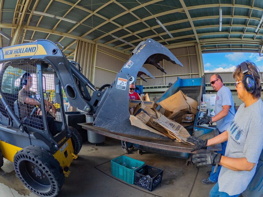 Staff at the Recycle Center separate cardboard as it is delivered. Pictured from left to right: Chad Fukinaga, Joe Lapera, Gary Reavis, and Jovita Ambrosia.