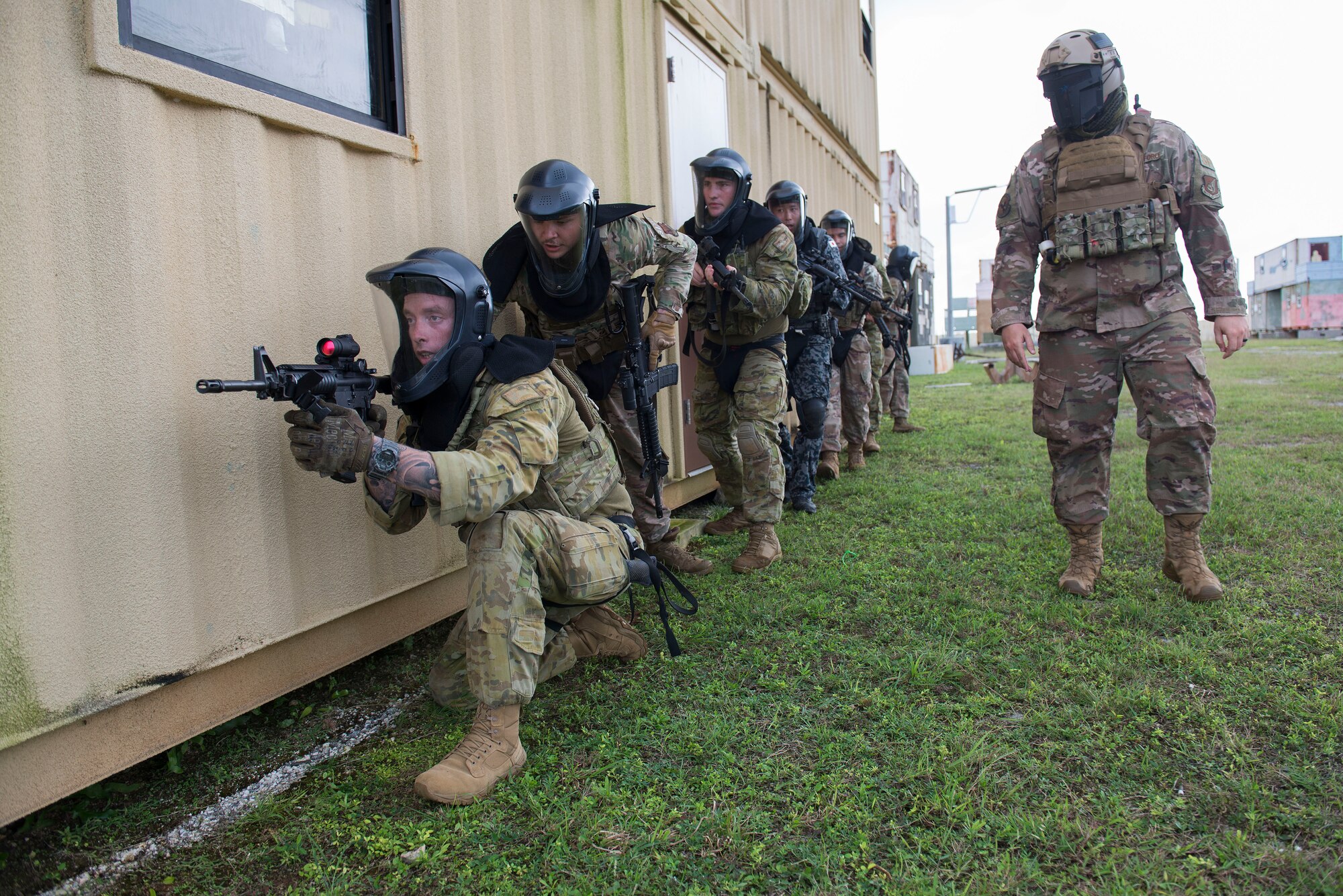 Members of the Royal Australian Air Force, U.S. Air Force, and Koku Jieitai (Japan Air Self-Defense Force) participate in a simulated live fire scenario during Pacific Defender 20-1 at the Pacific Regional Training Center near Andersen Air Force Base, Guam, Feb. 11, 2020.