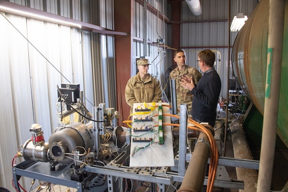 Tech. Sgt. Anthony Bennett and 1st Lt. Jack Robinson, both with the 821st Contingency Response Support Squadron, discuss the capabilities of a mobile power generator with Greg Thomas, Scaled Power lead propulsion engineer, during a demonstration at Scaled Power’s test facility in San Francisco, California, Feb. 3, 2020. In its continuing effort to become more light, lean and lethal, Airmen from the 821st Contingency Response Group assigned to Travis Air Force Base in California, continue to advance the concept of a smaller power generator, with the capability to support contingency response missions and Joint Services across the entire Global Air Distribution Network. (U.S. Air Force photo by Tech. Sgt. Liliana Moreno)