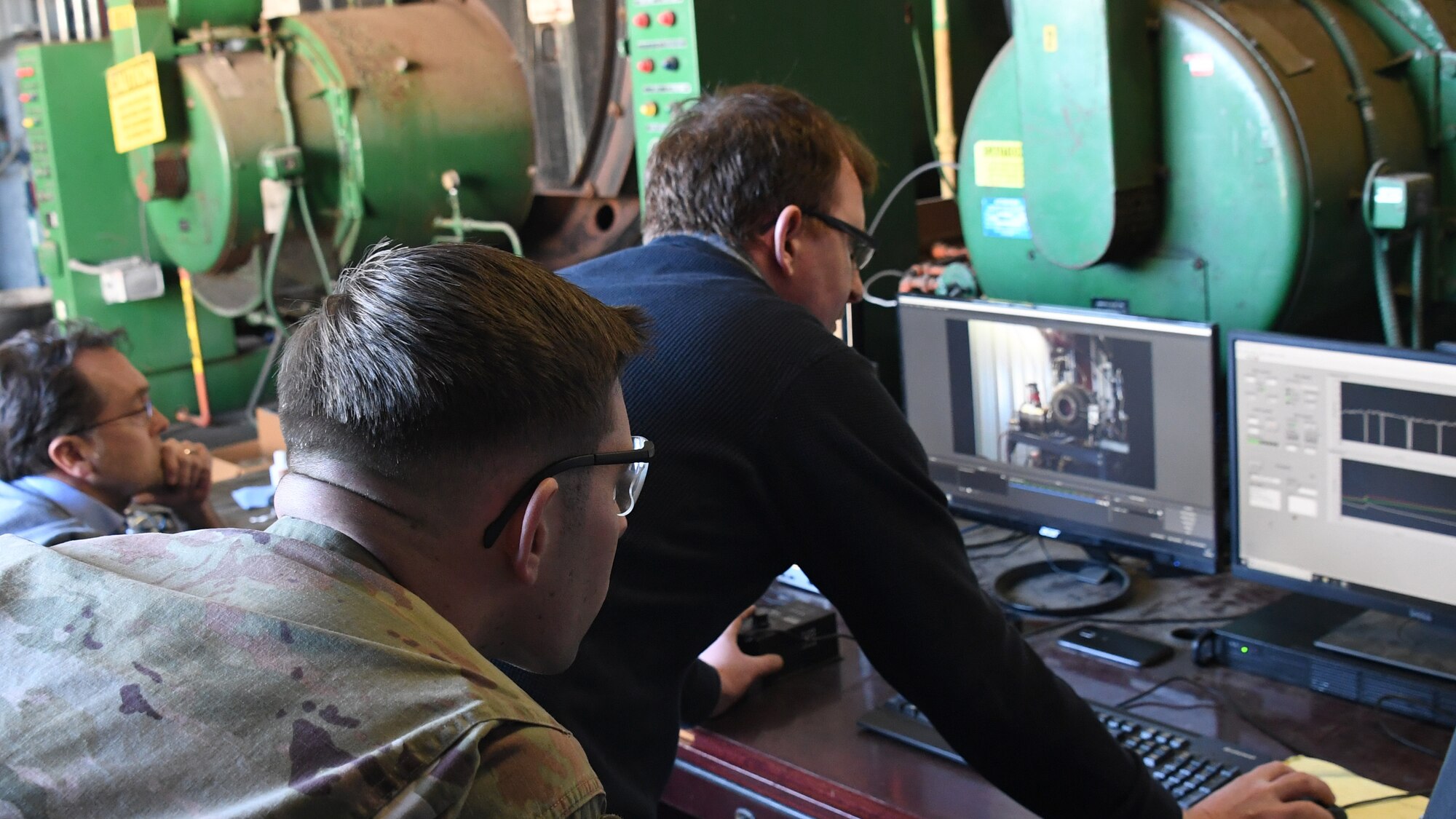 U.S. Air Force 1st Lt. Jack Robinson, 821st Contingency Response Support Squadron civil engineer officer, and Greg Thomas, Scaled Power lead propulsion engineer, observe the turbo generator demonstration which is in line with and completes phase-one of a three-phase Research, Development, Test and Evaluation project, at Scaled Power’s test facility in San Francisco, California, Feb. 3, 2020. To initiate Phase I, AFWERX and U.S. Transportation Command committed $120,000 each using Small Business Innovation Research funding. After receiving the contract, Scaled Power assessed the feasibility of the project and developed a generator prototype by combining one of their previously developed turbine engines with commercially available generator components. (U.S. Air Force photo by Tech. Sgt. Liliana Moreno)