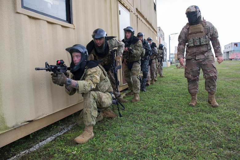 Members of the Royal Australian Air Force, U.S. Air Force, and Koku Jieitai (Japan Air Self-Defense Force) participate in a simulated live fire scenario during Pacific Defender 20-1 at the Pacific Regional Training Center near Andersen Air Force Base, Guam, Feb. 11, 2020.