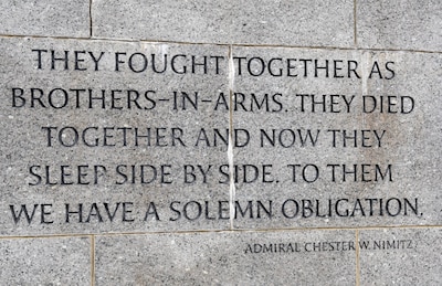 Inscription on stone wall of memorial.