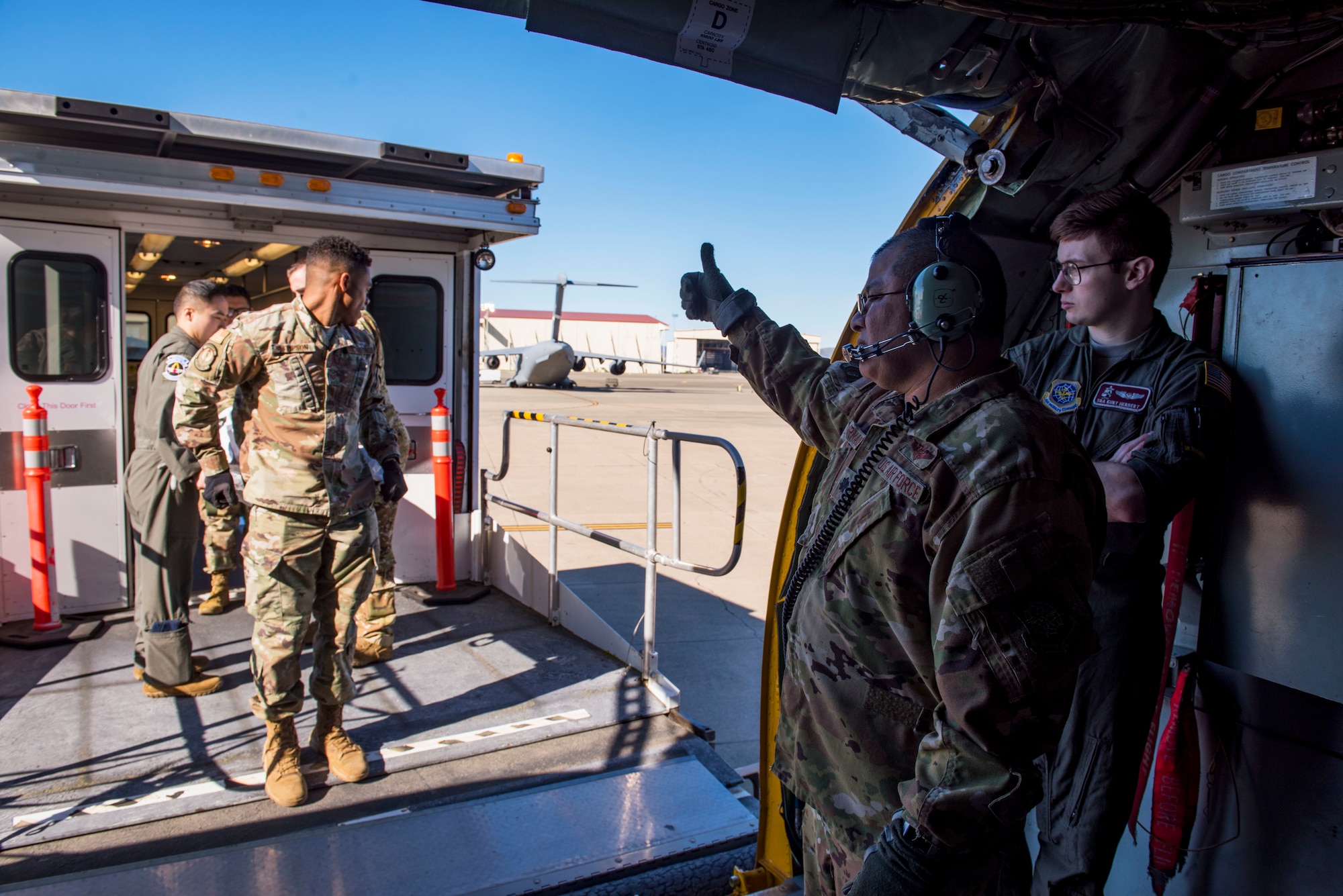 U.S. Air Force Lt. Col. David Hernandez, 43rd Aeromedical Evacuation Squadron chief flight nurse, directs the boarding of medical training mannequins onto a Fairchild Air Force Base KC-135 Stratotanker during an aeromedical evacuation mission at Travis Air Force Base, California, Feb. 11, 2020. This is Fairchild’s second Travis aeromedical evacuation training support mission, and with the new addition of the 60th AES team, Team Fairchild is looking forward to more training missions in the future. (U.S. Air Force photo by Senior Airman Lawrence Sena)