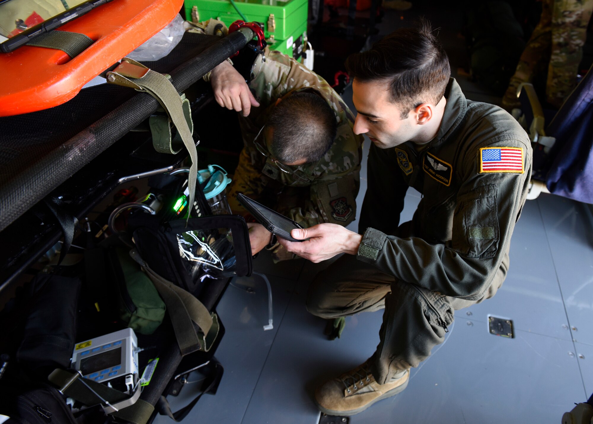 U.S. Air Force Lt. Col. David Hernandez (left), 43rd Aeromedical Evacuation Squadron chief flight nurse, and Tech. Sgt. Jeremey Anderson (right), 43rd AES aeromedical evacuation technician, prep medical equipment on a Fairchild Air Force Base KC-135 Stratotanker prior to an aeromedical evacuation mission at Travis Air Force Base, California, Feb. 11, 2020. The 43rd AES is currently transitioning from its present station at Pope Air Force Base to become part of the 60th AES at Travis Air Force Base, providing more training opportunities on the KC-10 Extender, C-5 Super Galaxy and C-17 Globemaster III based there, as well as KC-135s based out of Fairchild. (U.S. Air Force photo by Senior Airman Lawrence Sena)