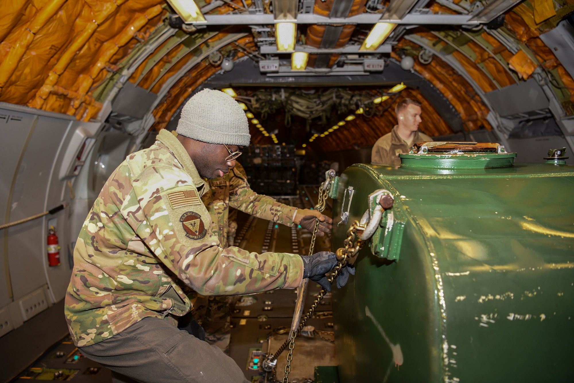 Senior Airman Kwame Ansah, 32nd Air Refueling Squadron boom operator, loads pallets onto a KC-10 Extender for a Black History Month heritage air-refueling flight on Joint Base McGuire-Dix-Lakehurst, New Jersey, Feb. 13, 2020. The purpose of the heritage flight was to showcase the accomplishments African-American have made in the U.S. Air Force. (U.S. Air Force photo by Senior Airman Ariel Owings)