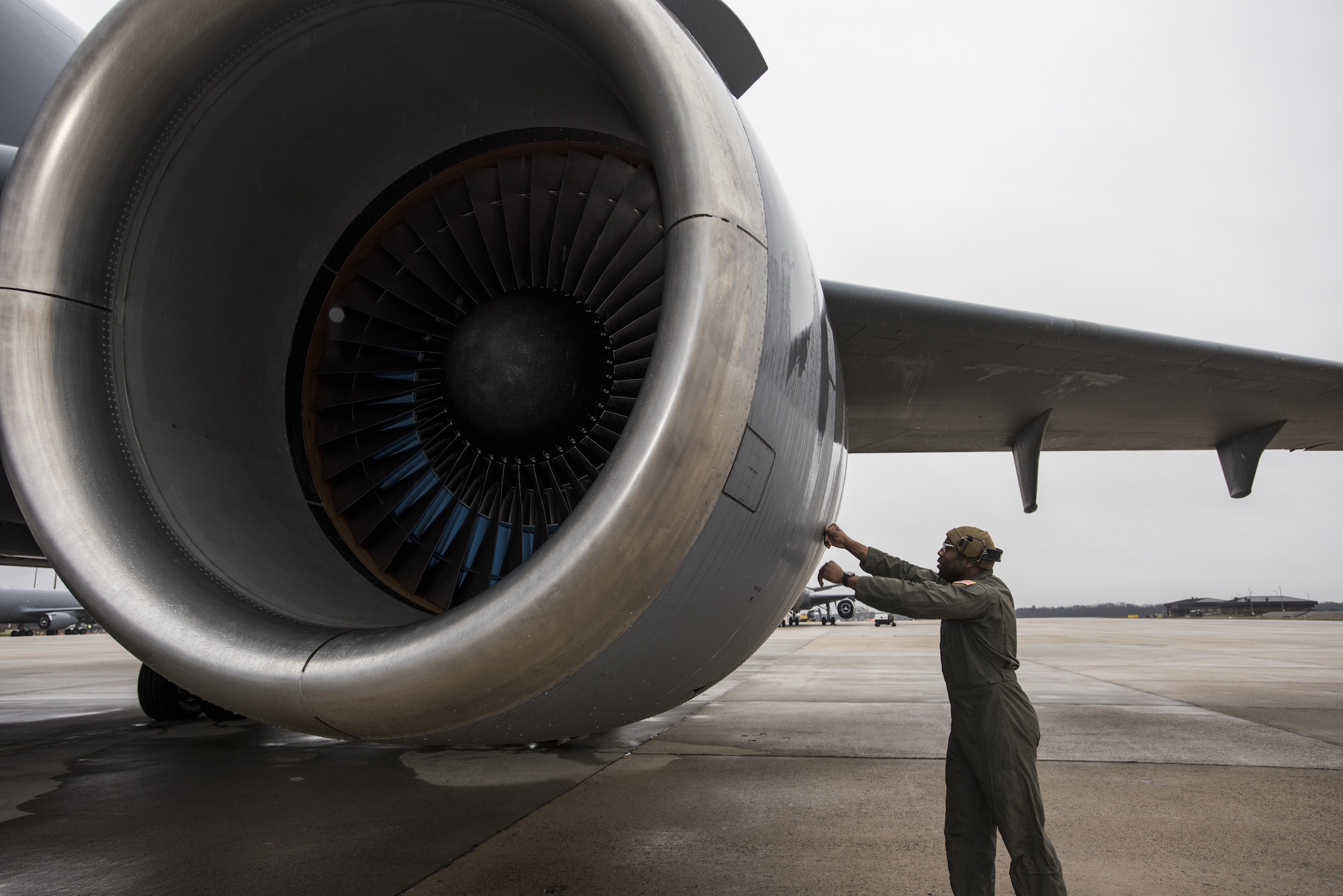 U.S. Air Force Staff Sgt. Demetrius Thornton, 605th Aircraft Maintenance Squadron primary flying crew chief, checks the engine of a KC-10 Extender in preparation for a Black History Month heritage air-refueling flight on Joint Base McGuire-Dix-Lakehurst, New Jersey, Feb. 13, 2020. Thornton explained that while organizing the flight to give recognition to his Wing and honor BHM, he realized how few African-American aircrew members there are. (U.S. Air Force photo by Senior Airman Ariel Owings)