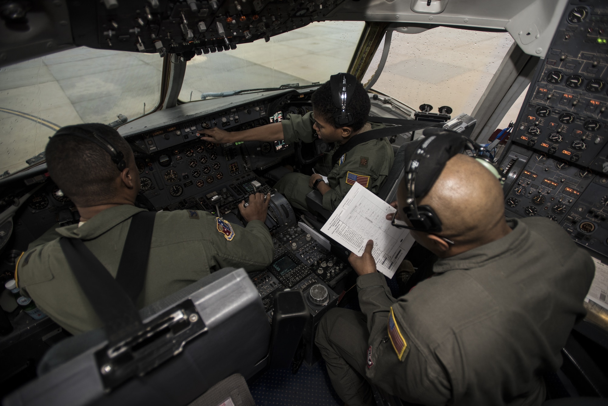 U.S. Air Force Col. Adrian Byers, 514th Air Mobility Wing vice commander, U.S. Air Force Maj. Lynn Grady, 305th Air Mobility Wing command executive, and Senior Master Sgt. Brian Pettaway, 2nd Air Refueling Squadron flight engineer, conduct flight control pre-checks before a Black History Month heritage air-refueling flight on Joint Base McGuire-Dix-Lakehurst, New Jersey, Feb. 13, 2020. Byers believes when military installations are able to put heritage flights together, it brings a sense of pride and remembrance of the legacy they came from. (U.S. Air Force photo by Senior Airman Ariel Owings)