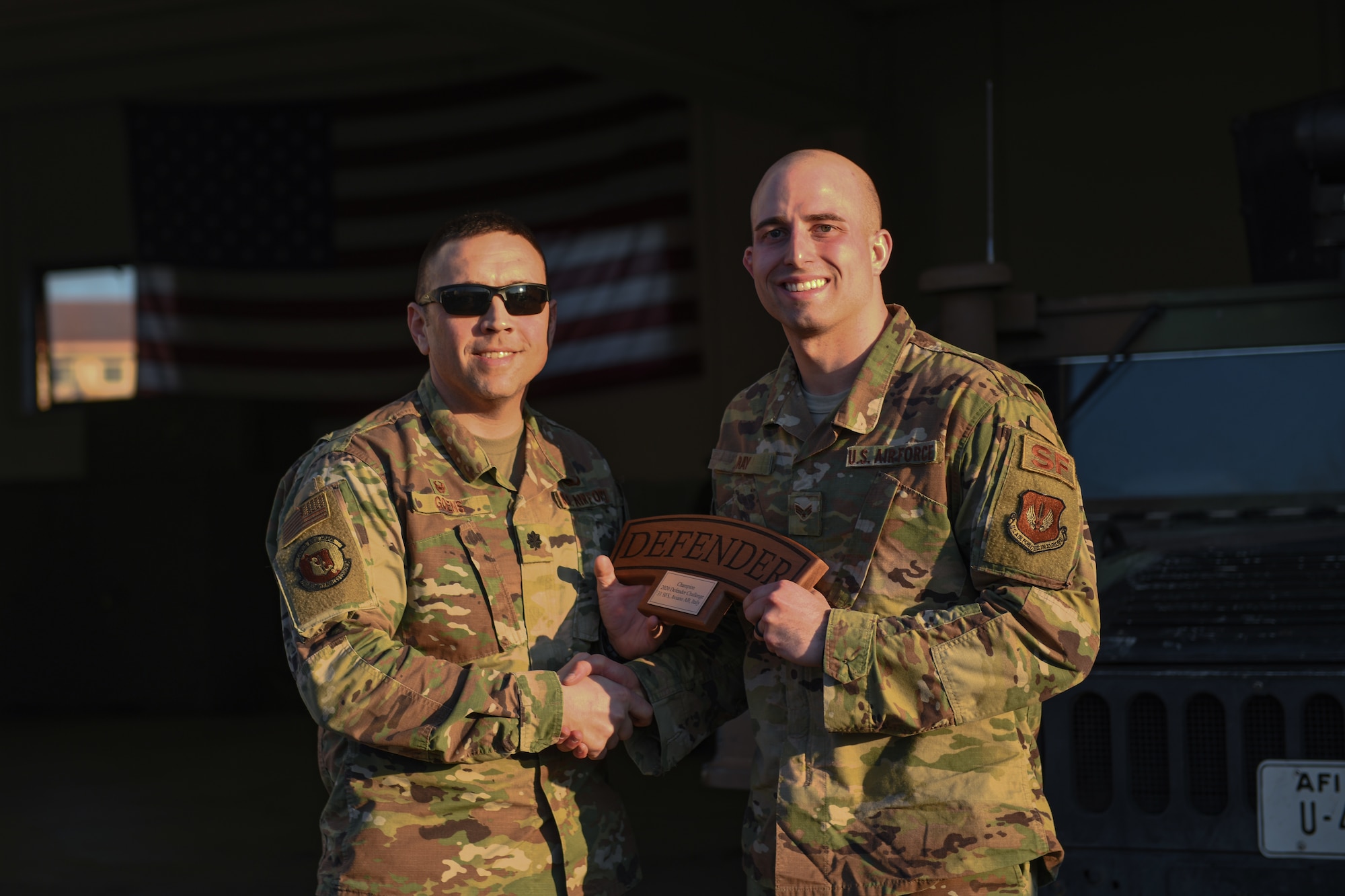 U.S. Air Force Lt. Col. Jesse Goens, 31st Security Forces Squadron commander, presents Aviano’s 2020 Defender Challenge award to Senior Airman Christopher L. Ray, 31st SFS member at Aviano Air Base, Italy, Feb. 14, 2020. Ray won first place. (U.S. Air Force photo by Airman 1st Class Ericka A. Woolever)