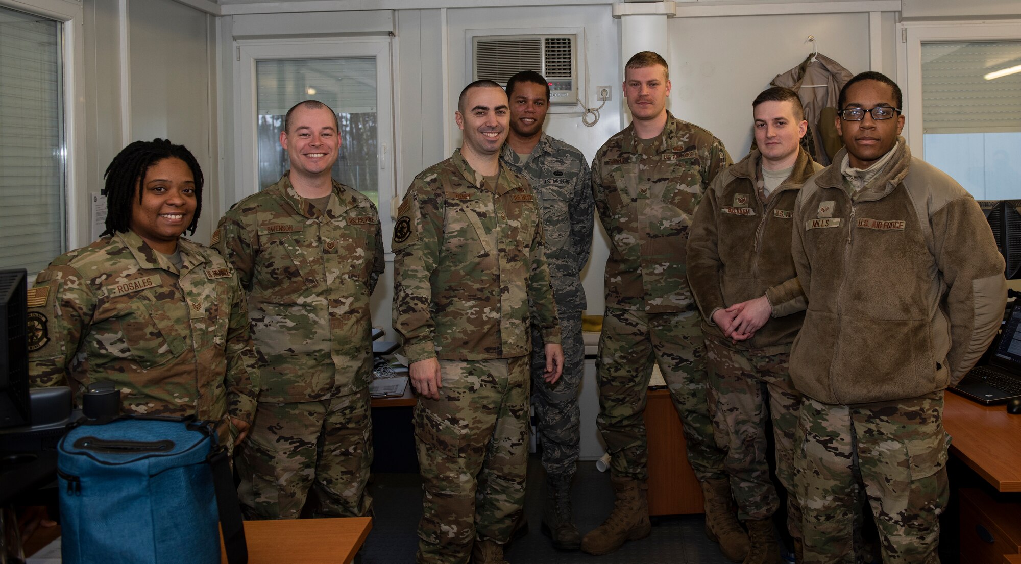 U.S. Air Force Master Sgt. Kevin Feeney, 701st Munitions Support Squadron first sergeant, third from the left, poses for a photo with 701st MUNSS communications flight Airmen at Kleine Brogel Air Base, Belgium, January 24, 2020. Feeney is responsible for first sergeant duties for more than 150 Airmen at Kleine Brogel Air Base and maintains a close relationship with them while stationed at the geographically separated unit. (U.S. Air Force photo by Airman 1st Class Alison Stewart)