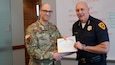 Capt. Charles Thompson, a full-time victim advocate for Utah National Guard’s Family Programs was recognized by Salt Lake City Police Department Chief Mike Brown during a command staff meeting at the Public Safety Building in Salt Lake City, “for going beyond the call of duty,” Feb. 12, 2020.