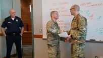 Capt. Charles Thompson, a full-time victim advocate for Utah National Guard’s Family Programs was recognized by Salt Lake City Police Department Chief Mike Brown during a command staff meeting at the Public Safety Building in Salt Lake City, “for going beyond the call of duty,” Feb. 12, 2020.