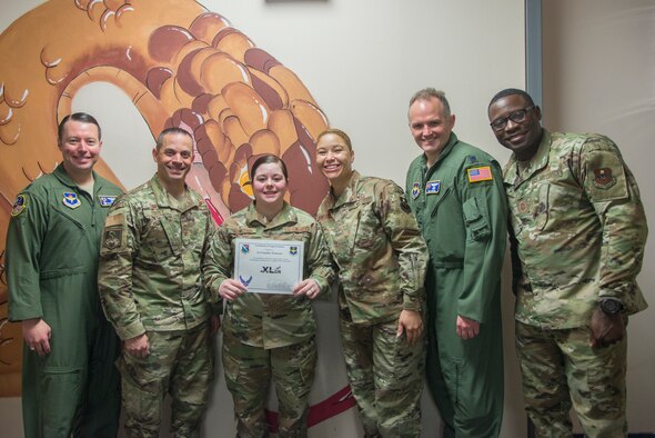 Senior Airman Sandra Troncoso, 47th Operations Support Squadron host aviation resource management (HARM) technician, was chosen by wing leadership to be the “XLer” of the week, Feb. 10, 2020, at Laughlin Air Force Base, Texas. The “XLer” award, presented by Col. Lee Gentile, 47th Flying Training Wing commander, and Chief Master Sgt. Brian Lewis, 47th Operations Group superintendent, is given to those who consistently make outstanding contributions to their unit and the Laughlin mission. (U.S. Air Force photo by Senior Airman Daniel Hambor)
