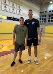 Senior Airman John Senn, left, 103rd Maintenance Squadron aerospace ground equipment maintainer, Connecticut Air National Guard, and Meyers Leonard, Miami Heat power forward, at the NBA team's practice facility in Miami, Fla.