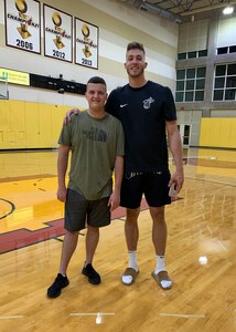 Senior Airman John Senn, left, 103rd Maintenance Squadron aerospace ground equipment maintainer, Connecticut Air National Guard, and Meyers Leonard, Miami Heat power forward, at the NBA team's practice facility in Miami, Fla.