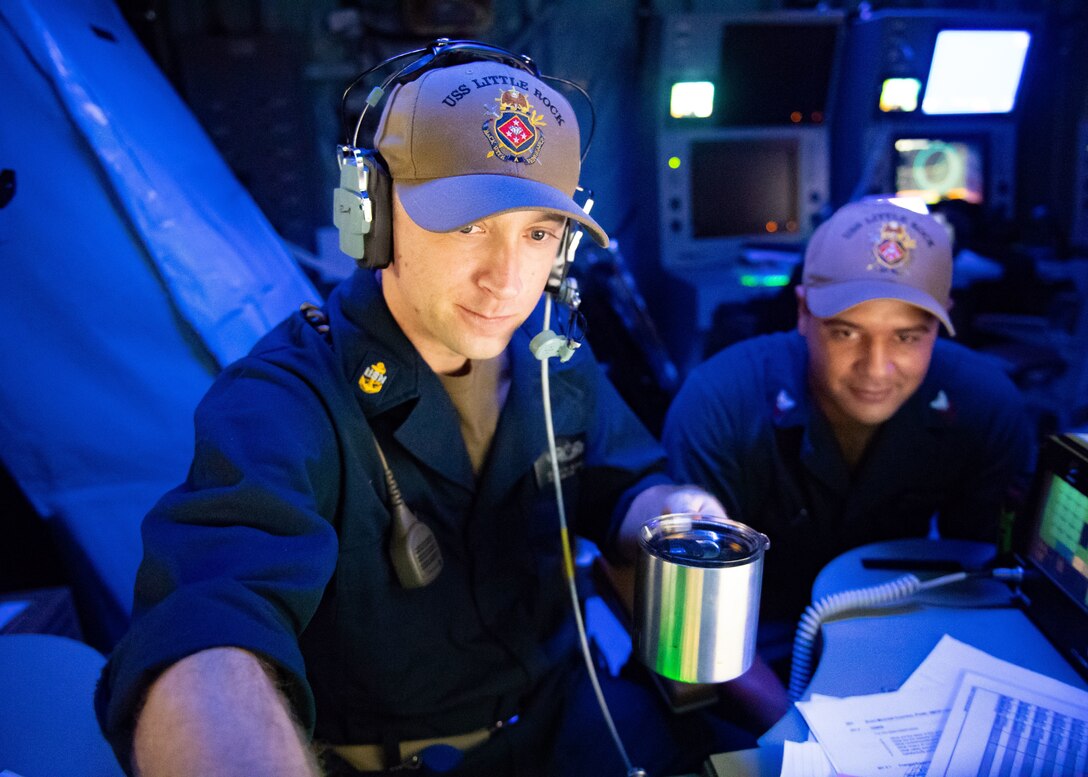Sailors in the mission control center aboard the Freedom-class littoral combat ship USS Little Rock.
