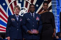 U.S. Air Force Col. Terrance A. Adams, commander 628th Air Base Wing and Joint Base Charleston, South Carolina, with his sister, Felicia Johnson, accepted the Military Service Award from General Maryanne Miller, commander Air Mobility Command, at the 2020 Black Engineer of the Year Stars and Stripes dinner, Feb. 14, 2020, Washington, D.C. Col. Adams earned the award for his over 14 years of service to BEYA and over 5,000 students reached.