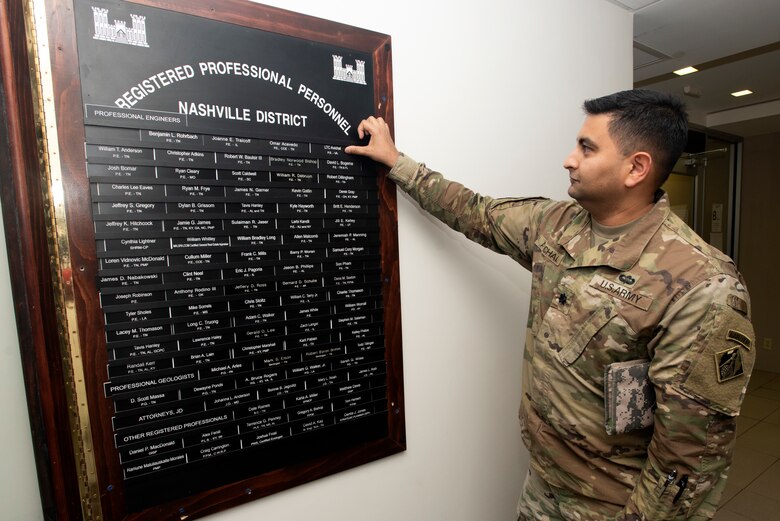 Lt. Col. Sonny B. Avichal, U.S. Army Corps of Engineers Nashville District commander, affixes his nameplate onto the "Registered Professional Personnel" board as a record of his achievement during a ceremony Feb. 19, 2020 at the district headquarters in Nashville, Tennessee. He passed his PE exam in the state of Virginia in April 2019. (USACE Photo by Lee Roberts)