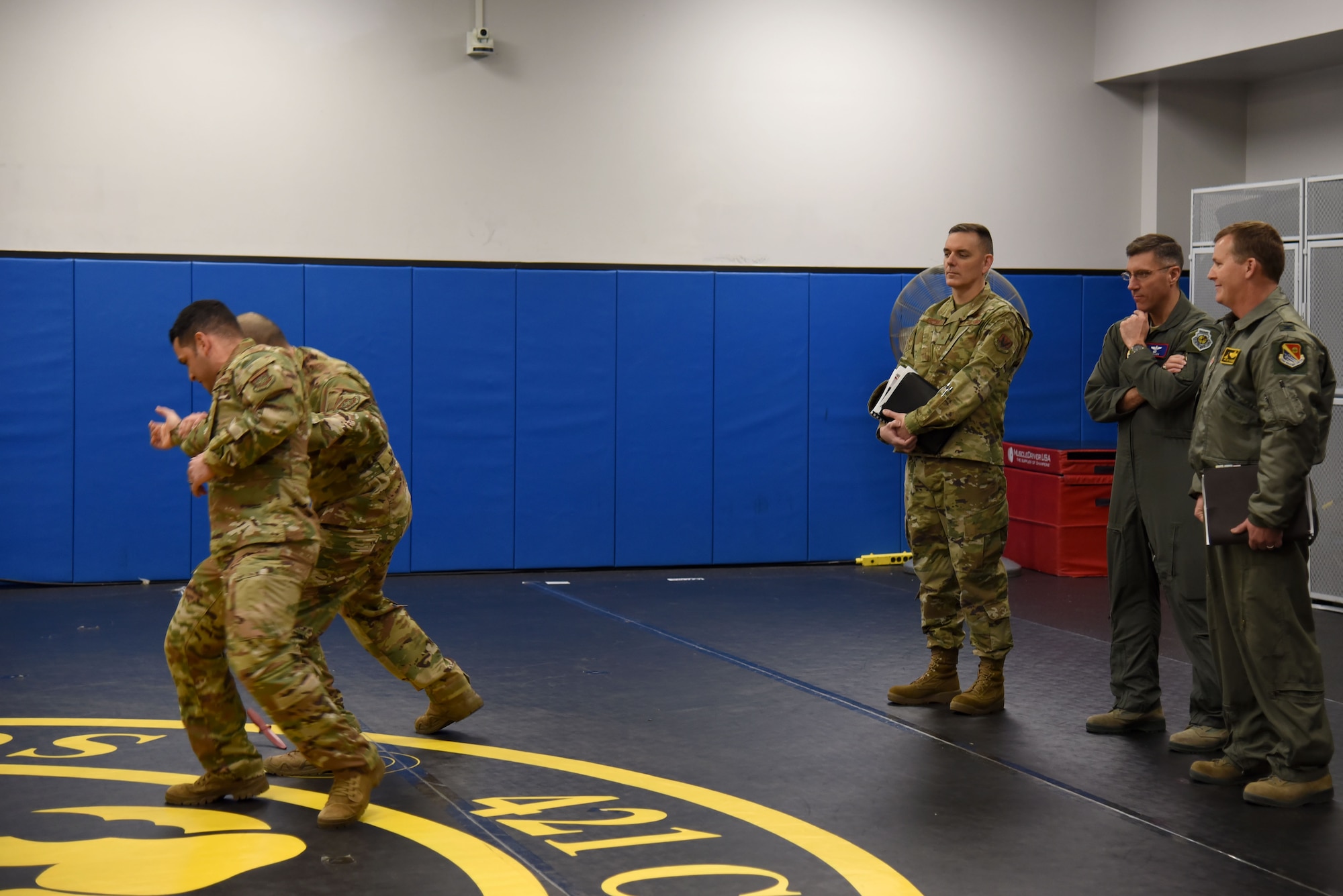 Photo of Airmen demonstrating weapons defensive principles