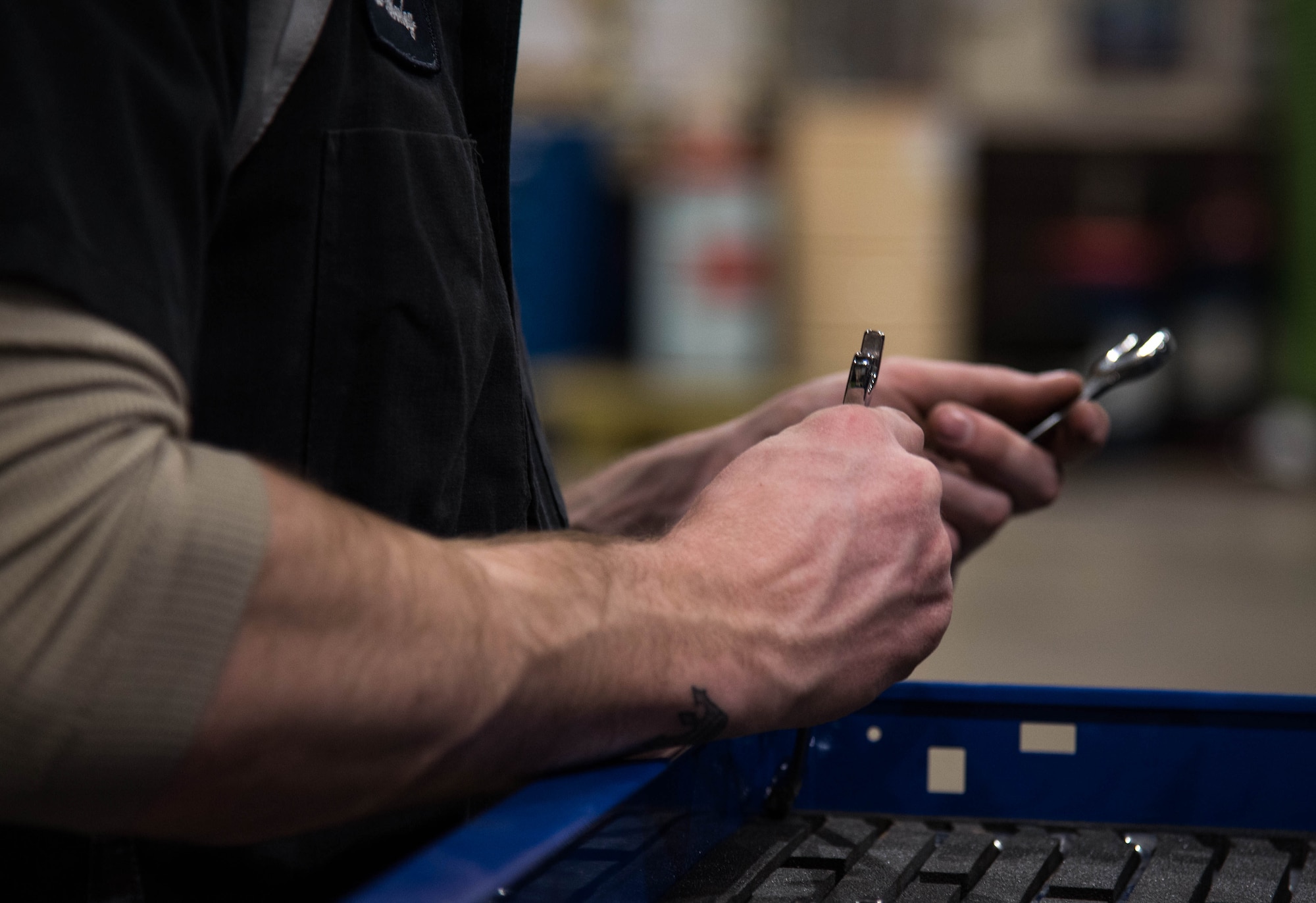 Vehicle maintainer selects his tools.