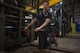 Airman 1st Class Patrick McNeeley works on a forklift.