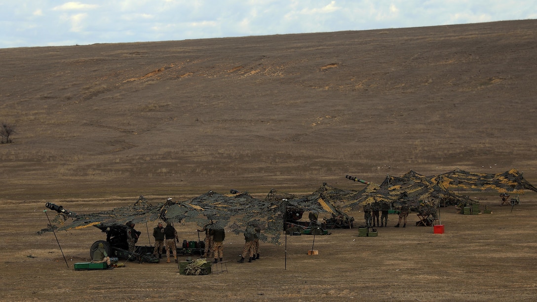 Romanian Soldiers provide artillery support at 1st Cavalry Division's Combined Arms Live Fire Exercise
