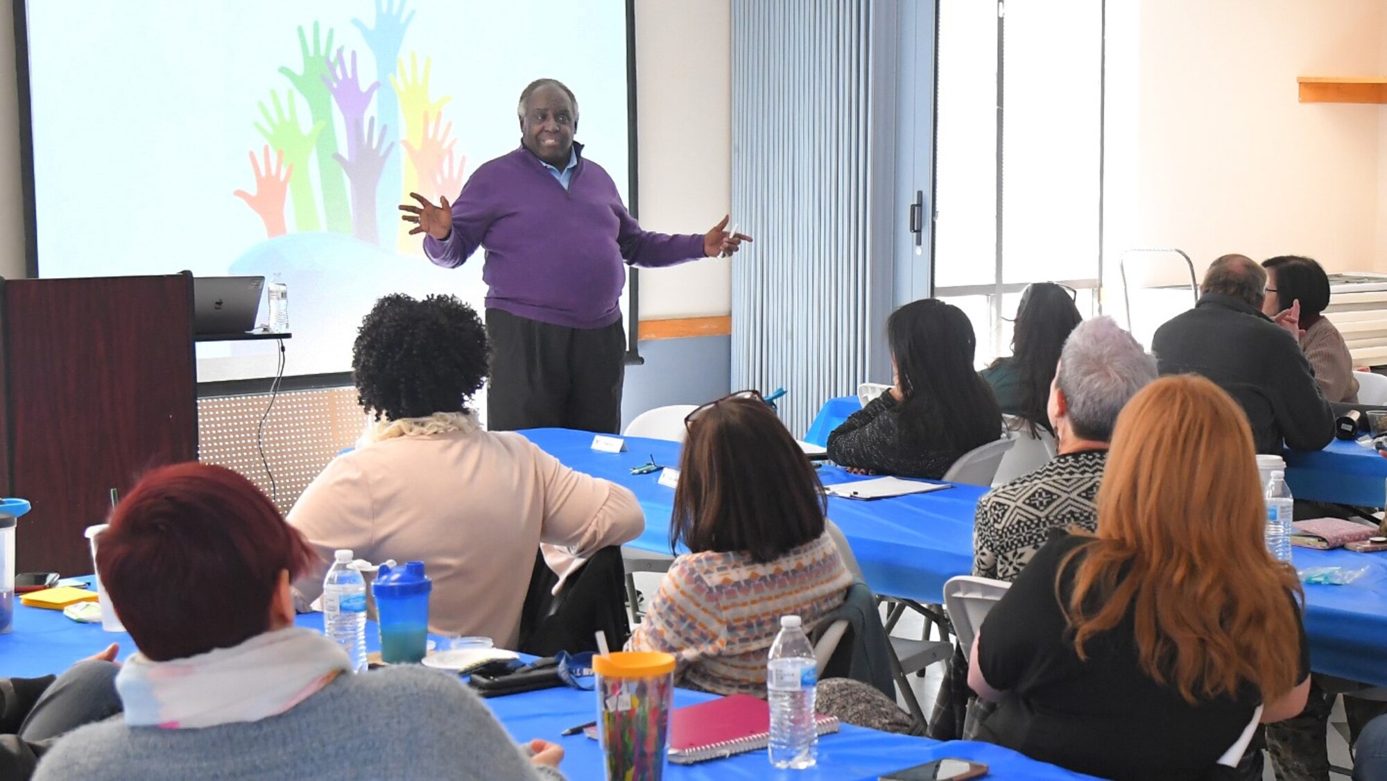 Mr. Parker making a presentation in front of an audience.