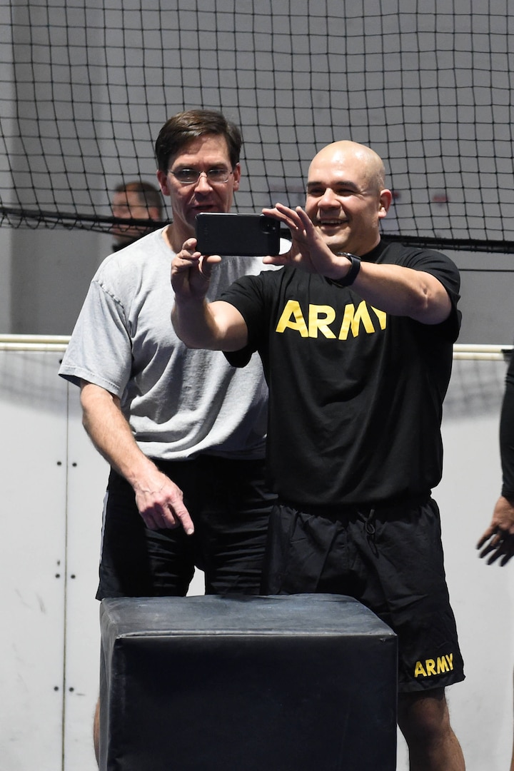 Secretary of Defense Dr. Mark T. Esper takes a “selfie” with U.S. Army Col. Joe Guzman following physical training at Offutt Air Force Base, Neb., Feb. 20, 2020. Esper participated in circuit training with more than 40 USSTRATCOM and 55th Wing service members, following up the workout with a question and answer session.