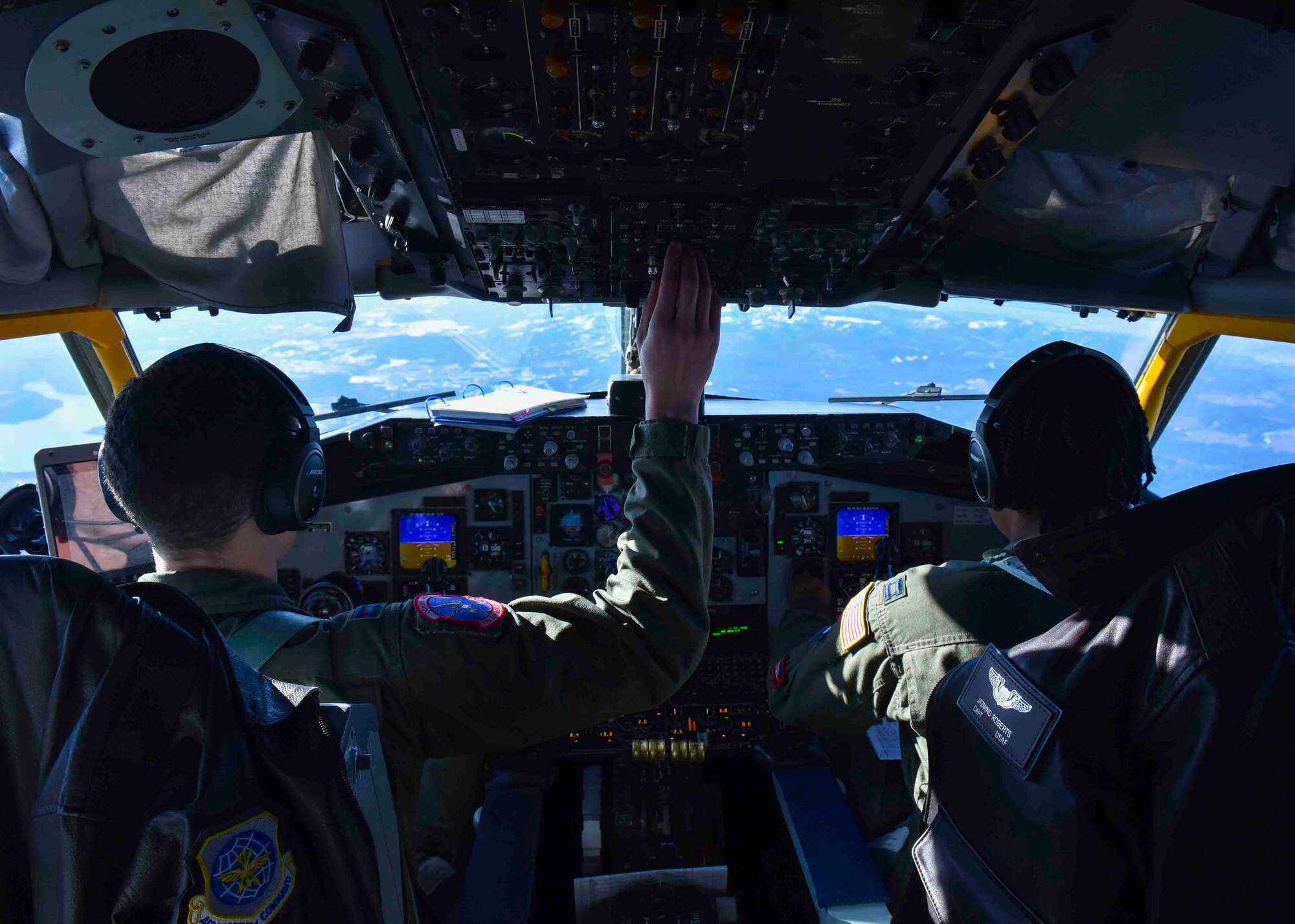 U.S. Air Force Capt. Clinton Prescott, 93rd Air Refueling Squadron pilot, and U.S. Air Force Capt. Jazmind Roberts, 93rd Air Refueling Squadron pilot, fly a Fairchild Air Force Base KC-135 Stratotanker over Idaho, February 19, 2020. Prescott, Roberts and six other black crew members flew a mission to Maxwell Air Force Base, Montgomery, Alabama, to celebrate the heritage and culture of black Airmen. (U.S. Air Force photo by Airman 1st Class Kiaundra Miller)