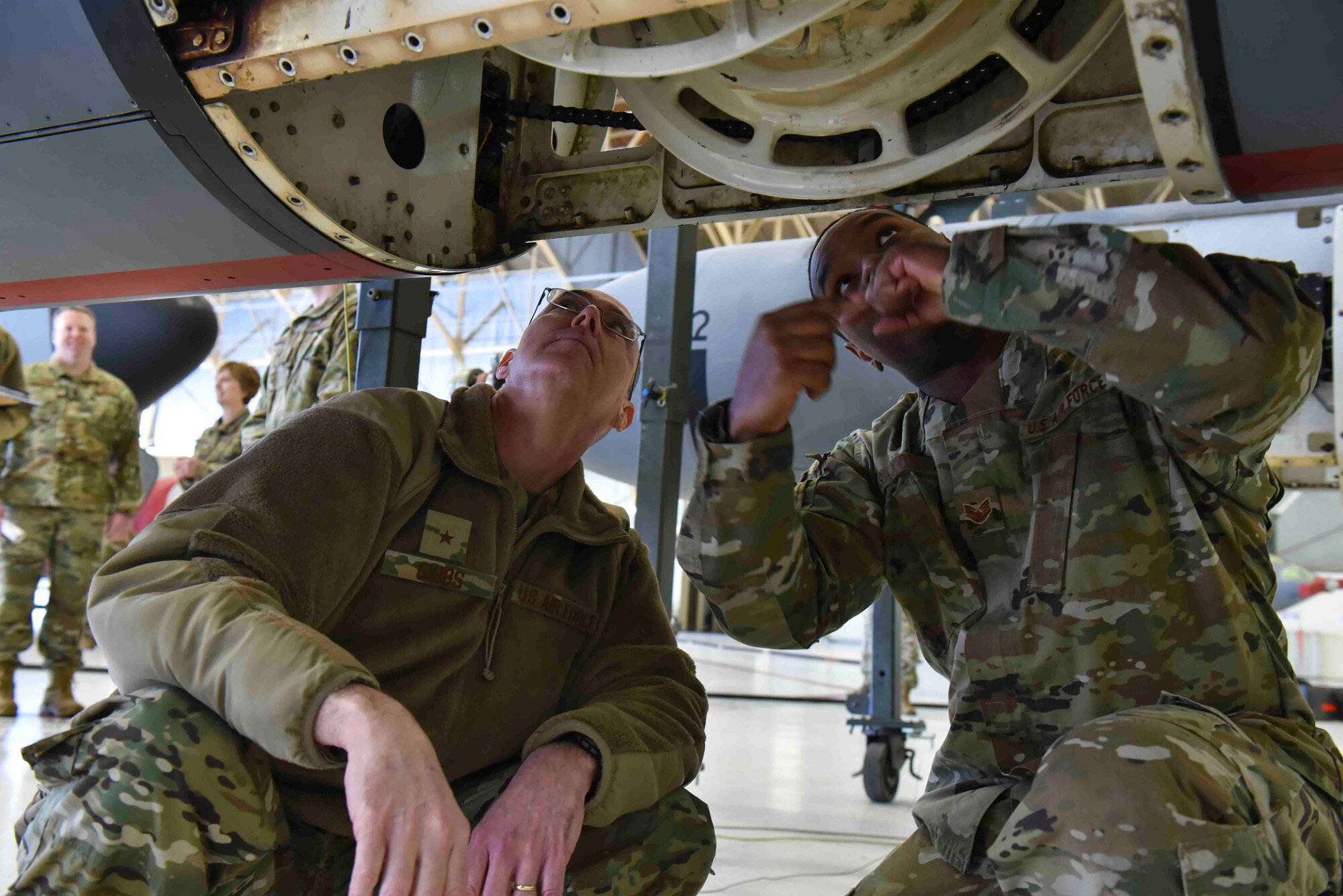 Brig. Gen. Richard Gibbs, Air Mobility Command director of logistics, engineering and force protection, is shown the inside of an air refueling pod by Staff Sgt. Dominiq Saxon, 92nd Maintenance Squadron aircraft hydraulic technician, during a tour at Fairchild Air Force Base, Washington, Feb. 10, 2020. The KC-135 Stratotanker refueling pod attachments can use a ‘basket’ style connector to enable it to refuel more types of aircraft.  (U.S. Air Force photo by Airman 1st Class Kiaundra Miller)
