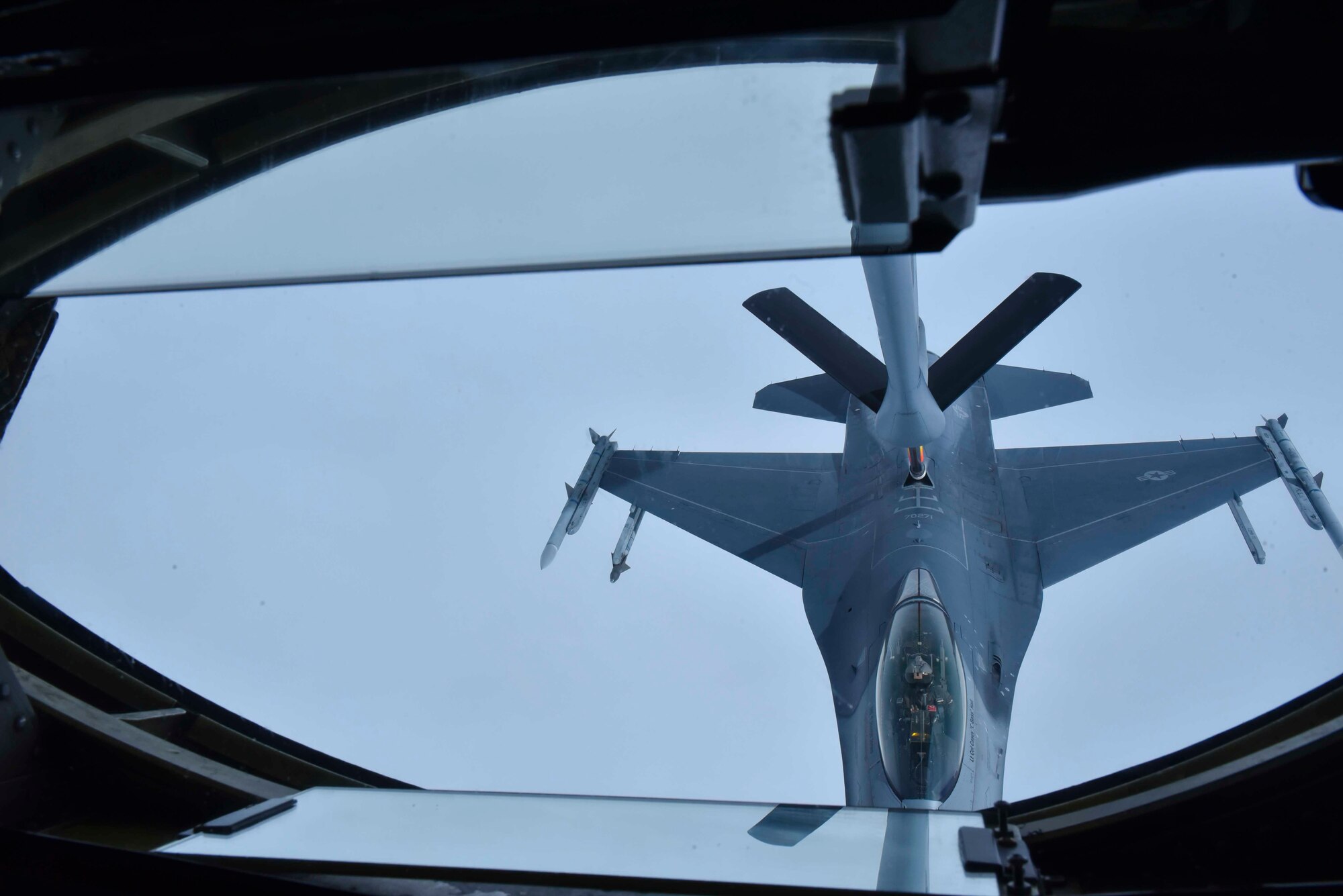 A Fairchild Air Force Base KC-135 Stratotanker refuels a Maxwell Air Force Base F-16 Fighting Falcon from the Red Tail Squadron of the 187th Fighter Wing from while flying over Alabama, February 18, 2020. The Red Tail Squadron was home to the Tuskegee Airmen, the first all-black squadron in the U.S. military. (U.S. Air Force photo by Airman 1st Class Kiaundra Miller)