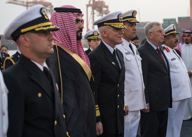 200216-N-KZ419-1419 JEDDAH, Kingdom of Saudi Arabia (Feb. 16, 2020) His Royal Highness Prince Sultan Bin Ahmed Bin Abdulaziz Al Saud, second left, Vice Adm. Jim Malloy, commander of U.S. 5th Fleet, center, and other members of the 75th Anniversary ceremony of the Quincy meeting between President Franklin D. Roosevelt and King Ibn Saud, stand at attention during evening colors aboard the guided-missile destroyer USS Farragut (DDG 99). The ceremony was held in recognition of the original Quincy Agreement which took place aboard the USS Quincy (CA-71) between U.S. President Franklin D. Roosevelt and King Abdul Aziz of Saudi Arabia Feb. 14, 1945. (U.S. Navy photo by Mass Communication Specialist 3rd Class Dawson Roth)