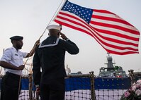 200216-N-KZ419-1409 JEDDAH, Kingdom of Saudi Arabia (Feb. 16, 2020) A U.S. Sailor, right, assigned to the guided-missile destroyer USS Farragut (DDG 99) and a Royal Saudi Arabian sailor conduct evening colors aboard the Farragut as part of the 75th anniversary ceremony of the Quincy meeting between President Franklin D. Roosevelt and King Ibn Saud. The ceremony was held in recognition of the original Quincy Agreement which took place aboard the USS Quincy (CA-71) between U.S. President Franklin D. Roosevelt and King Abdul Aziz of Saudi Arabia Feb. 14, 1945. (U.S. Navy photo by Mass Communication Specialist 3rd Class Dawson Roth)