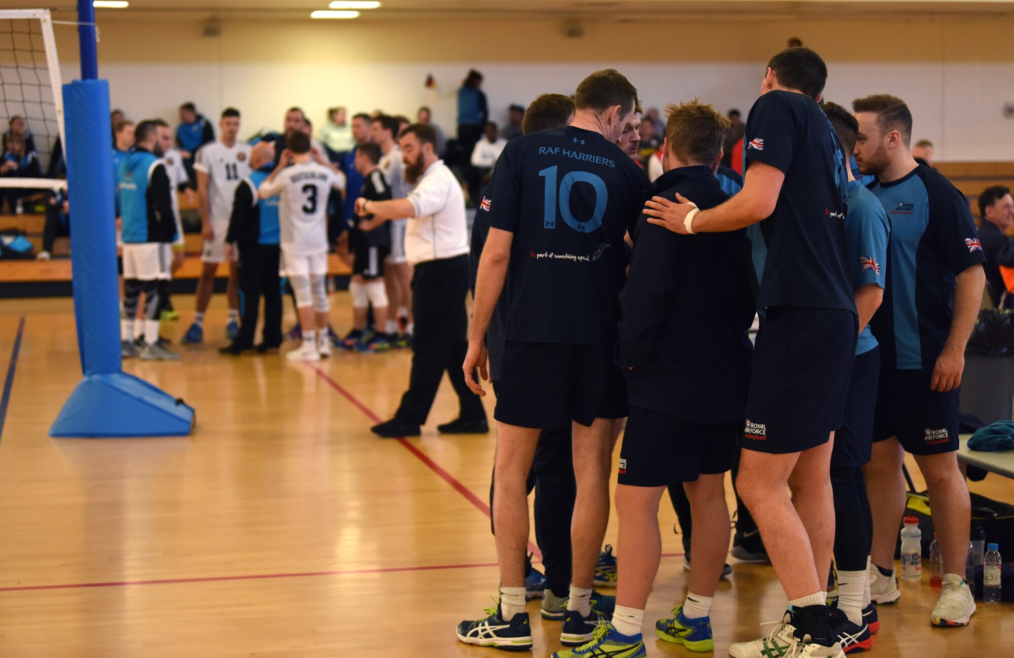 Members of the Royal Air Force are coached during the 2020 Allied Air Command Inter-Nation Volleyball Championship at RAF Mildenhall, England, Feb. 19, 2020.  The aim of the Allied Air Command Sports Board mission is to encourage and assist the promotion of inter-nation sporting activities. (U.S. Air Force photo by Senior Airman Brandon Esau)