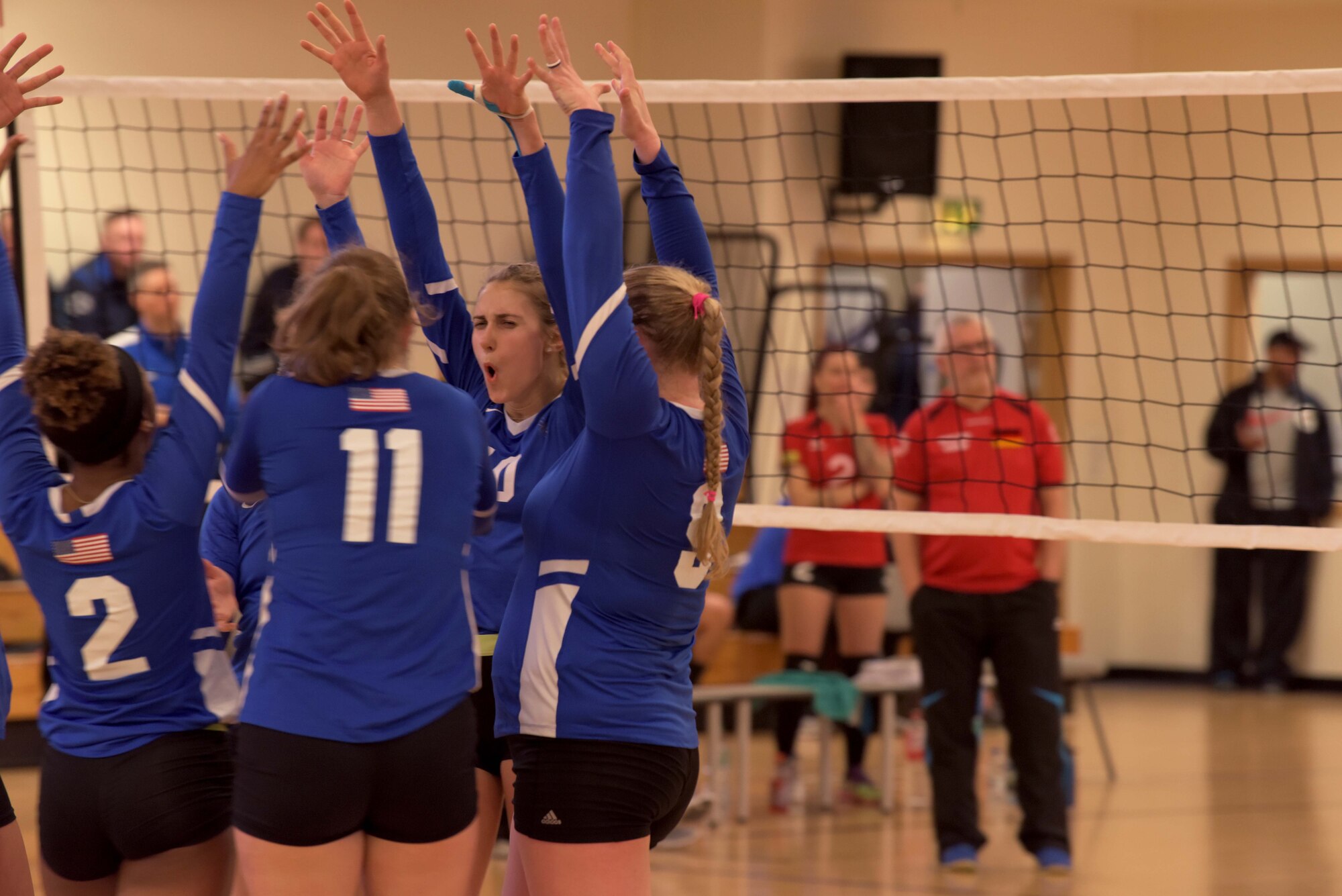 Members of the United States Air Forces in Europe women’s volleyball team celebrate during the 2020 Allied Air Command Inter-Nation Volleyball Championship at RAF Mildenhall, England, Feb. 20, 2020. The aim of the Allied Air Command Sports Board mission is to encourage and assist the promotion of inter-nation sporting activities. (U.S. Air Force photo by Senior Airman Benjamin Cooper)