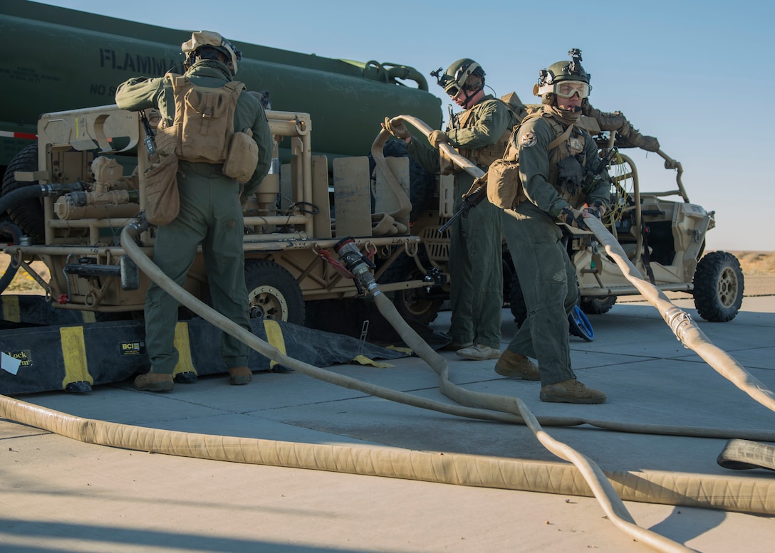 U.S. Marines with Marine Wing Support Squadron 371, Marine Wing Support Group 37, 3rd Marine Aircraft Wing, operate a tactical aviation ground refueling system during a forward area refueling point operation at Marine Corps Air Station Yuma, Feb. 4.