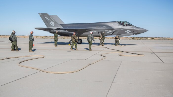 U.S. Marines with Marine Wing Support Squadron 371, Marine Wing Support Group 37, 3rd Marine Aircraft Wing and Marine Fighter Attack Squadron 122, Marine Aircraft Group 13, 3rd MAW, work together to refuel an F-35B Lighting II during a forward area refueling point operation at Marine Corps Air Station Yuma, Feb. 4.