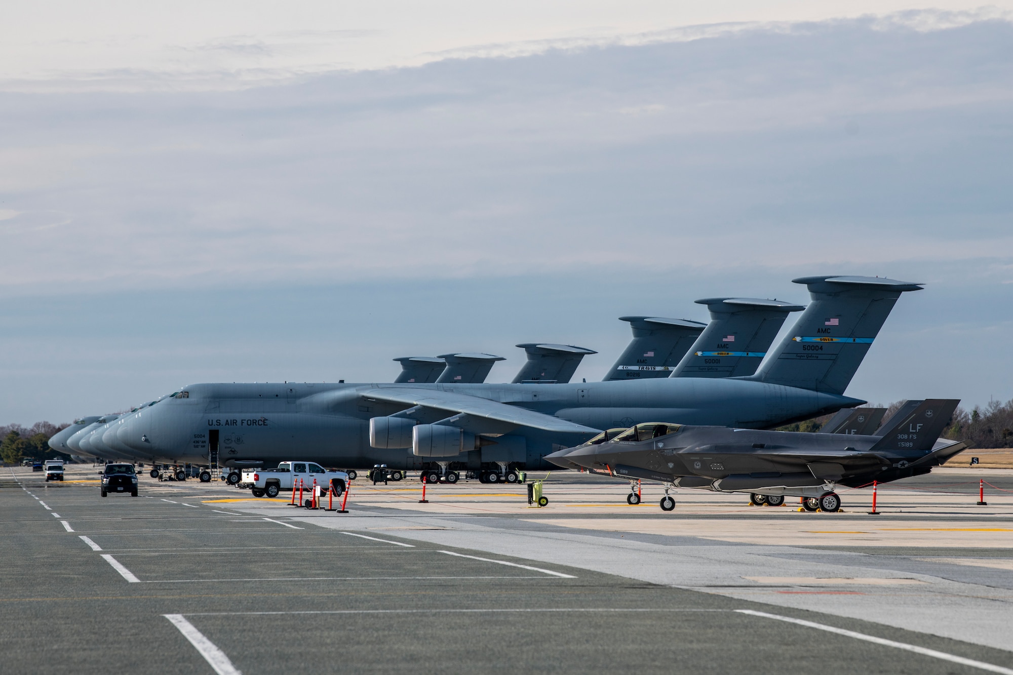 Two F-35A Lightning II aircraft from Luke Air Force Base, Arizona, sit on the flight line at Dover AFB, Delaware, Feb. 18, 2020. Two F-35As recently returned from participating in the HX Challenge held near Tampere, Finland. During the HX Challenge, five different aircraft were tested for seven days, in Finnish weather conditions, to assess their ability to replace the current fleet of Finnish air force FA-18C and FA-18D Hornets. (U.S. Air Force photo by Senior Airman Christopher Quail)