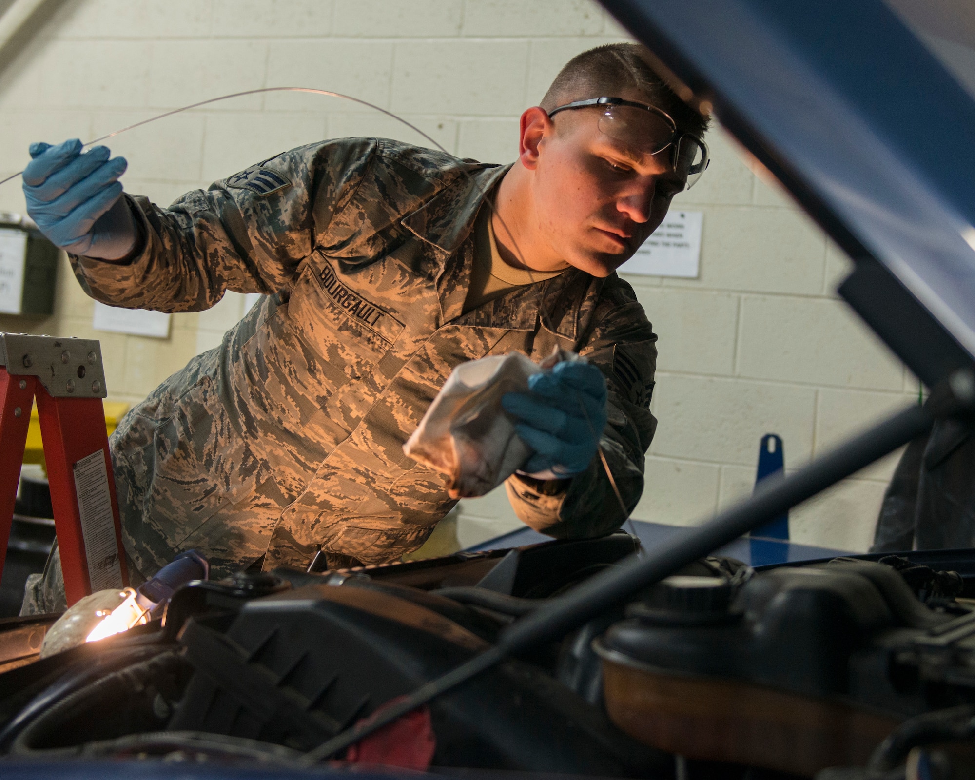 Senior Airman Thomas Bourgault, 103rd Logistics Readiness Squadron vehicle maintenance journeyman, checks the oil on a pickup truck at Bradley Air National Guard Base, East Granby, Conn. Feb. 8, 2020. Vehicle maintenance specialists perform scheduled maintenance and necessary repairs to Bradley’s entire fleet of vehicles, ensuring readiness of organizations throughout the installation, including aircraft maintenance and fire and emergency services. (U.S. Air National Guard photo by Staff Sgt. Steven Tucker)