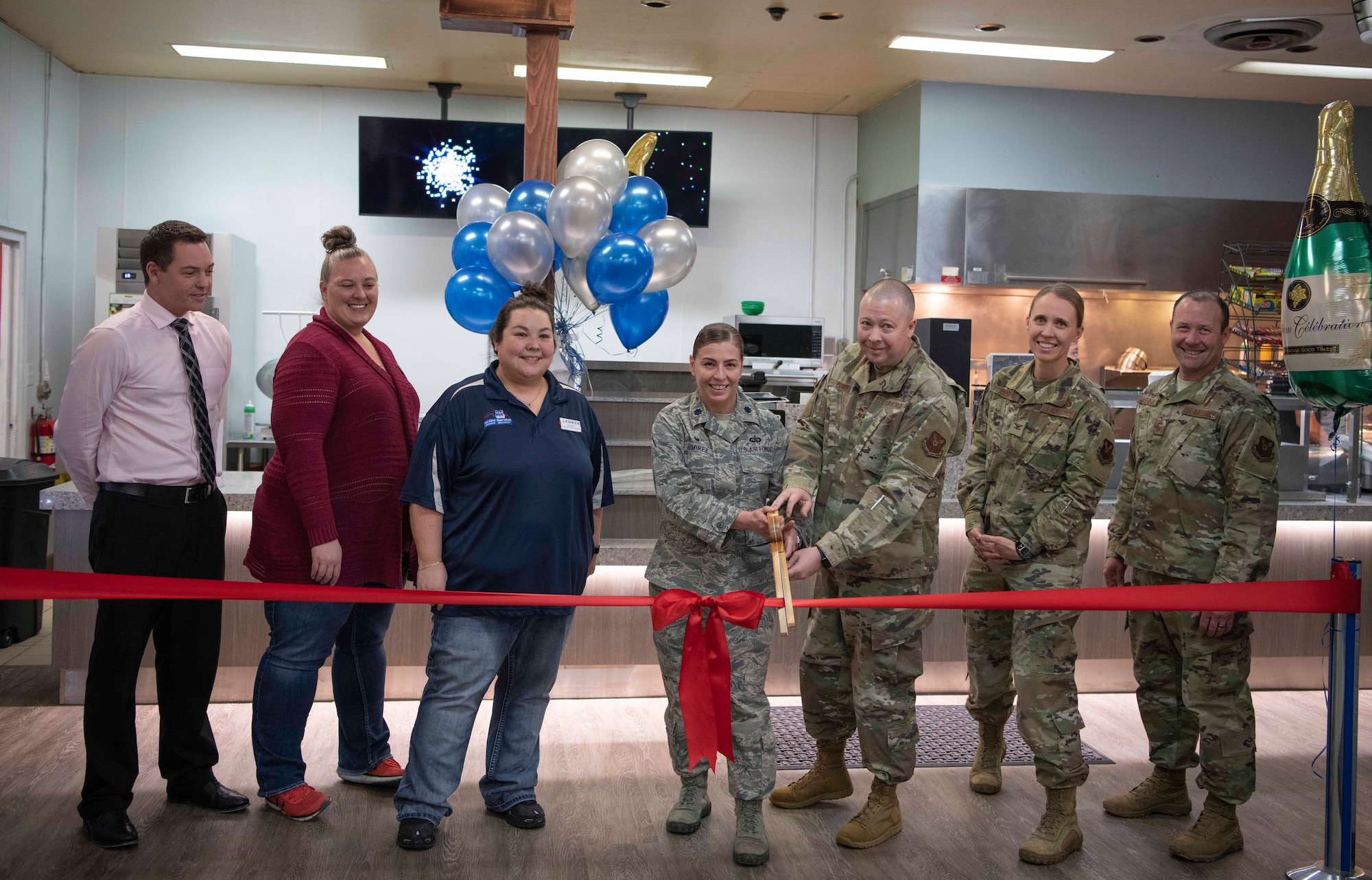 Lieutenant Colonel Isabella Ramirez, 90th Force Support Squadron commander, and Chief Master Sgt. Jason Penny, 90th FSS chief enlisted manager, cut the ribbon for the grand re-opening of Warren Lanes, Feb. 18, 2020, on F.E. Warren Air Force Base, Wyo. The bowling alley closed in December for a restoration project. (U.S. Air Force photo by Senior Airman Braydon Williams)